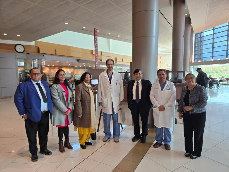 Mr Peerzada, Dr Sneh Chauhan, VC Prof Naima Khatoon, Dr Aaron Sasson, Prof Irfan Beg, Dr Shamim Khan and Dr Tazeen Beg in the lobby of Stony Brook University Hospital